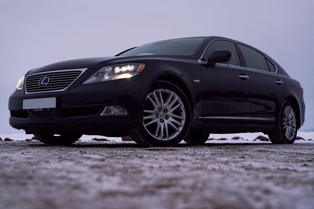 Mastering the First Impression: Your intriguing post title goes here Sleek black Lexus LS 460 in a winter parking lot. Luxury car with bold design.