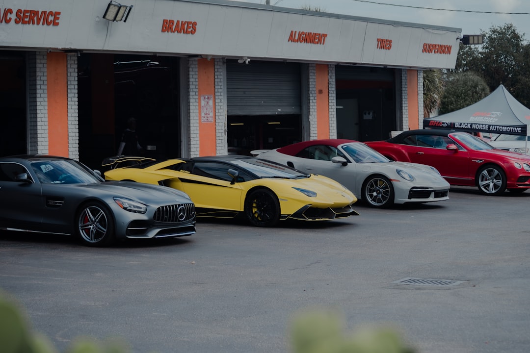 services-09 luxury-sports-cars-are-parked-in-front-of-a-garage-4kdrbnbznd4